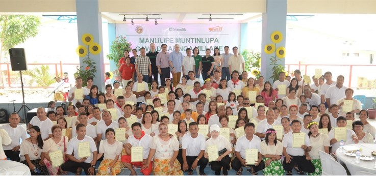 Turnover ceremony: MP and MBPS awarding unit titles to beneficiaries of the Manulife Muntinlupa Gawad Kalinga Village