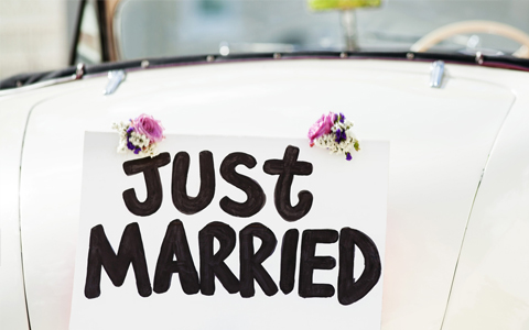 Close-up Just Married sign attached on convertible car's trunk. Horizontal shot.